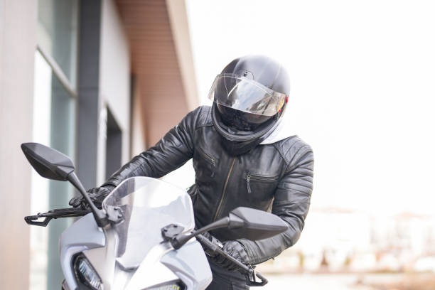 young man riding a racing motorcycle