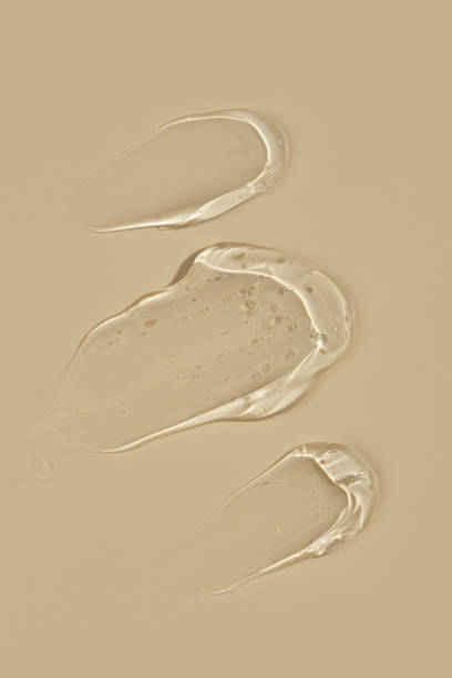 istock strokes of transparent gel on a beige background, macro texture 1996089953