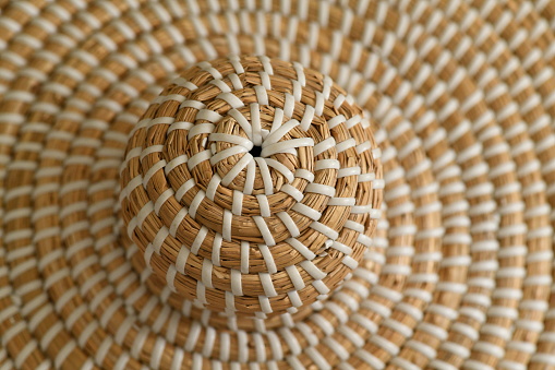 Delicate swirl of hand-crafted wicker. Peaceful and soothing to the eye