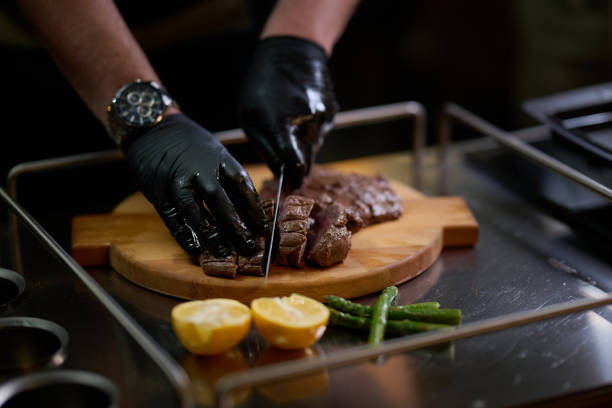 istock Close-up shot, a professional chef expertly prepares a delicious steak using modern cooking techniques, showcasing culinary excellence and precision in the art of gourmet cuisine 1996128261