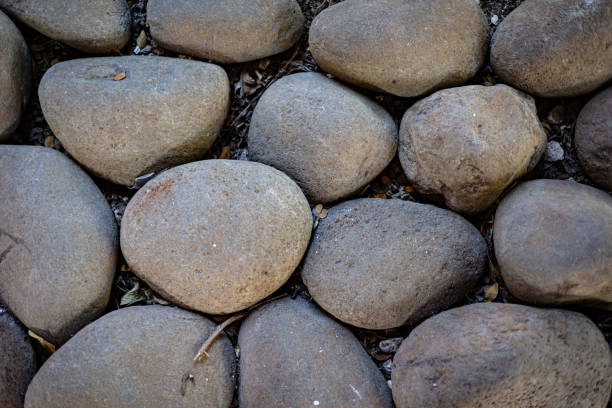 Backgrounds created using large oval stones and pebbles in a creative manner.