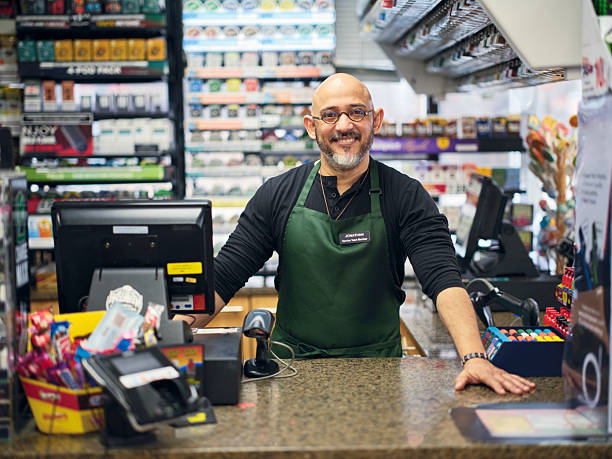 istock Small Business Owner at Work in His Small Convenience Store 1996144749