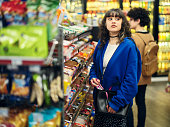 Young Woman Shoplifting in a Convenience Store