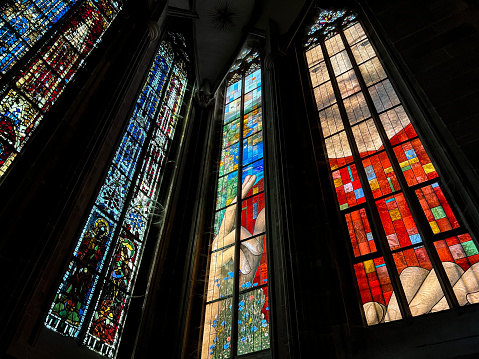 Sun glowing behind a window of Saint John’s Basilica in Den Bosch