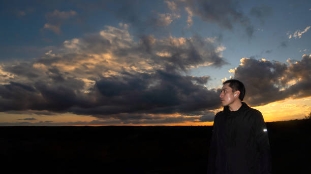 istock Sporty man with beautiful sunset background and space for text 1996241550