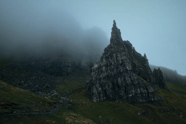 istock Atmospheric view of high sharp cliffs covered in fog 1996251118
