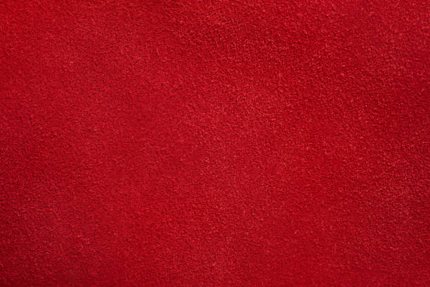 istock Red suede texture. Red background of natural dyed suede macro. 1996260678