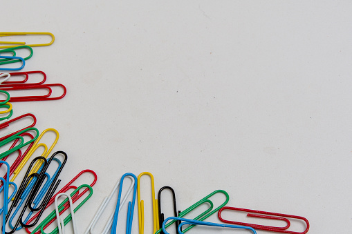 Colorful paper clips on white background
