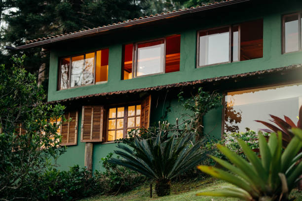 istock Exterior of a home with a lush yard at dusk 1996357697