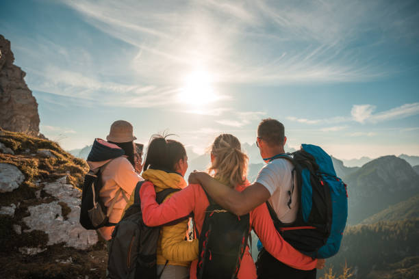 istock Diverse Group Embracing and Enjoying Mountain Trek on a Sunny Day 1996377964