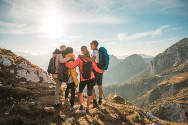istock Diverse Friends Embracing and Having Fun at Mangart Saddle on a Sunny Day 1996378482