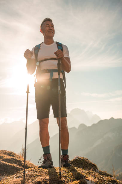 istock Mature Asian Man Explores Sunny Mountain Path 1996379513