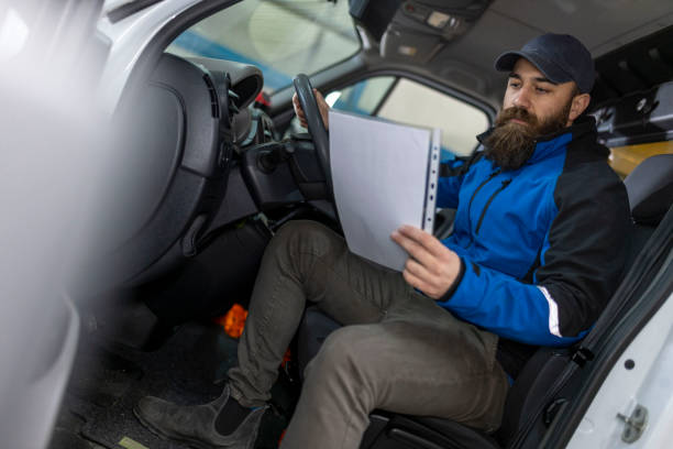 istock Delivery truck driver delivering packages 1996394547