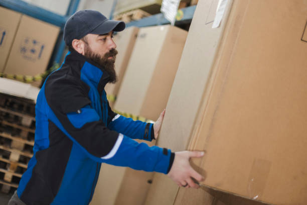 istock The warehouseman arranges packages in the warehouse 1996394554