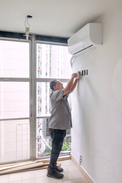 istock Electrician fixing the socket in the room 1996397767