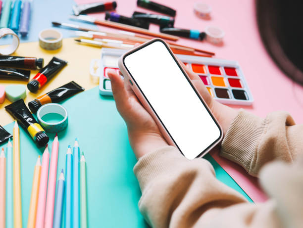 istock A child with a phone in his hands during an online lesson, space for your screenshot 1996410479