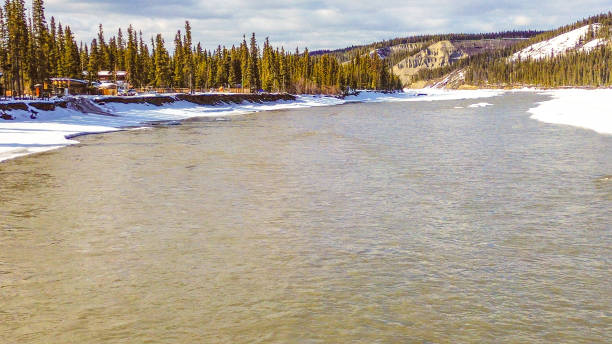 A drone flight over the frosty landscape of Interior Alaska is evidence that colder temperatures have arrived.  The Copper River, once full of spawning salmon, is now entering a time of rest. Ice begins to form on the river as well. On this cold day the river forges on despite the frigid temperatures.