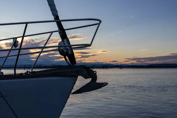 Photo of Silhouette of Sail Boat at Sunset