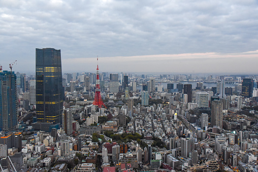 View from helicopter flying over Shinjuku high raised buildings