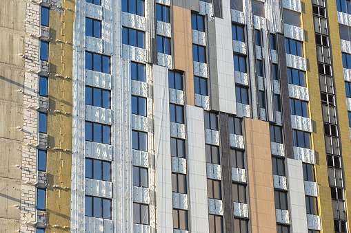 Modern Building Under Construction with Insulation Layers Exposed