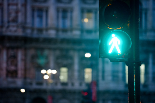 Walking/No Walking Pedestrian Crossing Sign Signaling Walk at Night in the Streets of Rome, Shallow Depth of Field, Copy Space