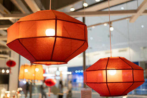 Red lamp shade. Hanging Lamp with Red Shade, Modern Chandelier with Light Bulb.