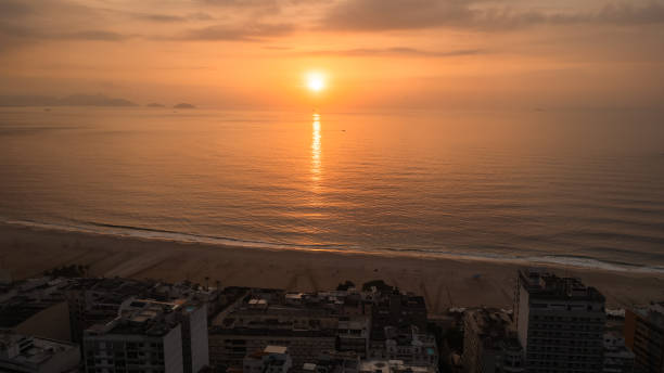 Landscape with a view from above of the sun rising in Copacabana