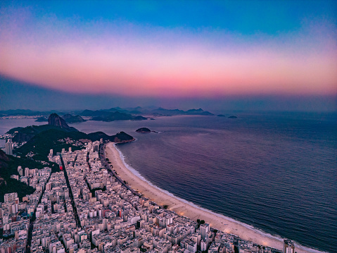 Landscape of the beach and Copacabana neighborhood, in a late afternoon with purple colors