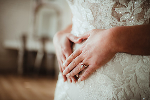 Bride with her engagement ring on her hand
