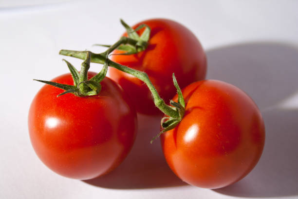 istock Fresh ripe tomatoes isolated on white background 1996613403