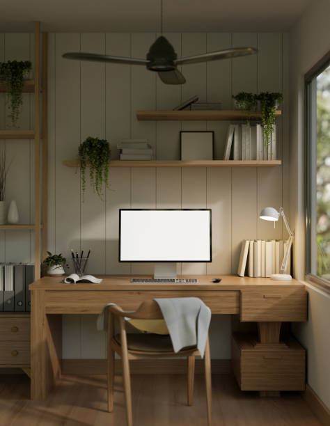 istock A cosy minimalist home office with a white-screen computer mockup on a wooden desk. 1996640192