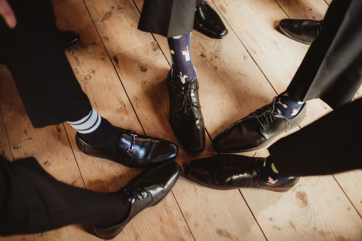 Groomsmen with dress shoes and fancy socks
