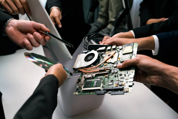 istock Business people holding electronic waste on isolated background. Quaint 1996732671