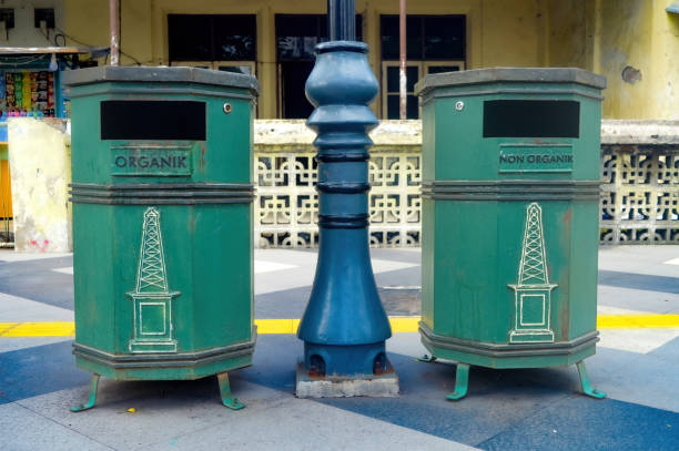 istock two green trash cans on the pedestrian or pathway or sidewalk 1996735360