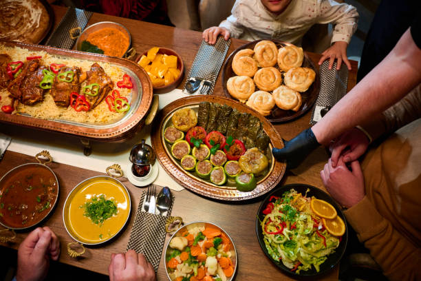 istock In this captivating aerial view, delicious food adorned with Ramadan decorations, including dates and meat, awaits the arrival of an European Islamic family, promising a festive and flavorful iftar celebration 1996753055