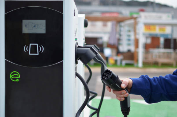 istock Charging an electric car with a power cable at the charging station. 1996785469