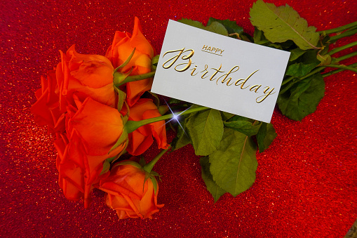 postcard , Internet banner  with a birthday greeting, with the inscription - happy birthday, a bouquet of flowers with a note of congratulations, roses