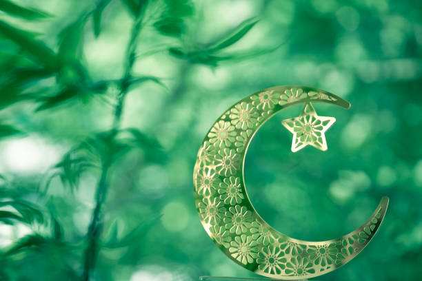 crescent moon on the natural green background, Eid Mubarak and Ramadan Kareem background, Half moon isolated on green bokeh background, 2024 Ramadan concept poster image with copy space for text