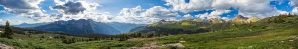 istock Mountain panorama at sunset with sun rays and pools of light with dramatic sky 1996961752