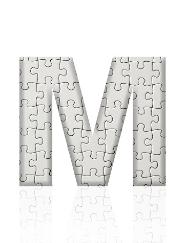 Close-up of three-dimensional blank jigsaw puzzle alphabet letter M on white background.