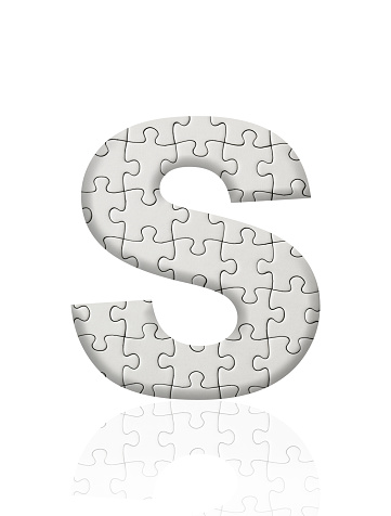 Close-up of three-dimensional blank jigsaw puzzle alphabet letter S on white background.
