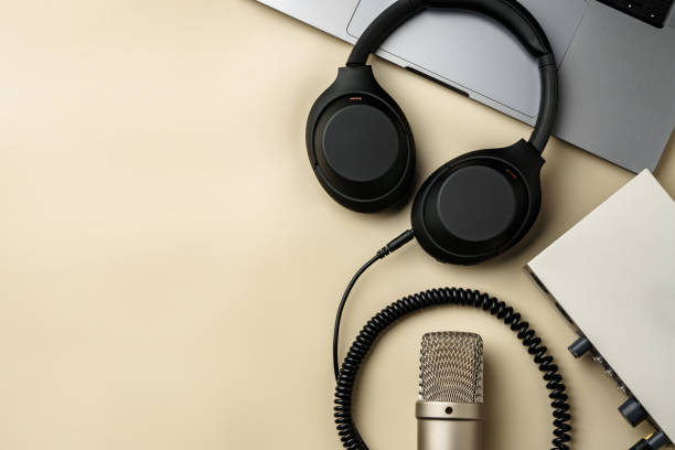 istock Headphones and microphone on the table close up 1996991325