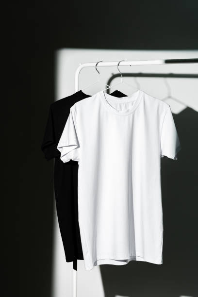 istock Blank T-shirt hanging in a spotlight in studio 1996996579