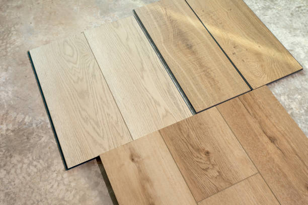 istock Top View Luxury Vinyl Wood Samples Lying On Concrete Floor In House. Choosing, Selecting Waterproof Flooring. Home Reconstruction. Vinyl Tiles Collection, Patterns. Interior Design Idea. Horizontal. 1997017599
