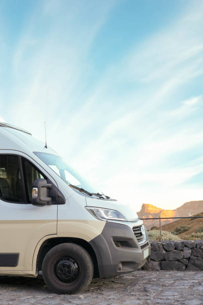 istock Camper Van Parked in Serene Desert Landscape at Dusk 1997022244