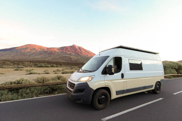 istock White Van on a Mountain Road at Dusk with Teide volcano in the background 1997027394