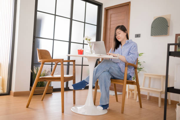 istock asian woman freelancer relax and happy during working from home 1997028963