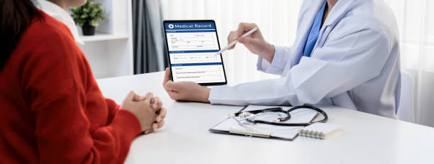istock Laptop display medical report on blurred doctor office. Rigid 1997049502