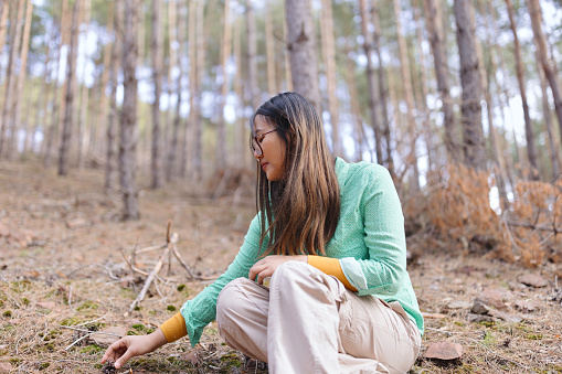 Multiracial woman exploring nature on a beautiful day