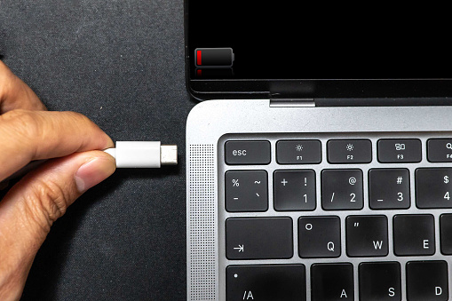 Laptop users are using USB type C cables to connect to other devices.
